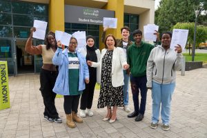 Cadbury students and principal celebrating A Level results